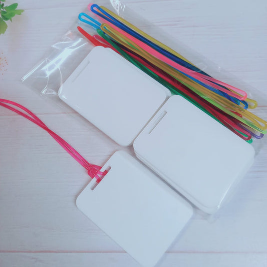 Pack 10 amarras plásticas para tag mix colores + Acrílico BLANCO 6x8cm
