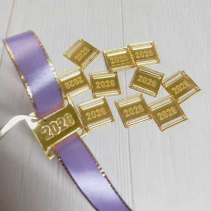 Dije Acrílico espejo dorado 2026 para medallas 100un